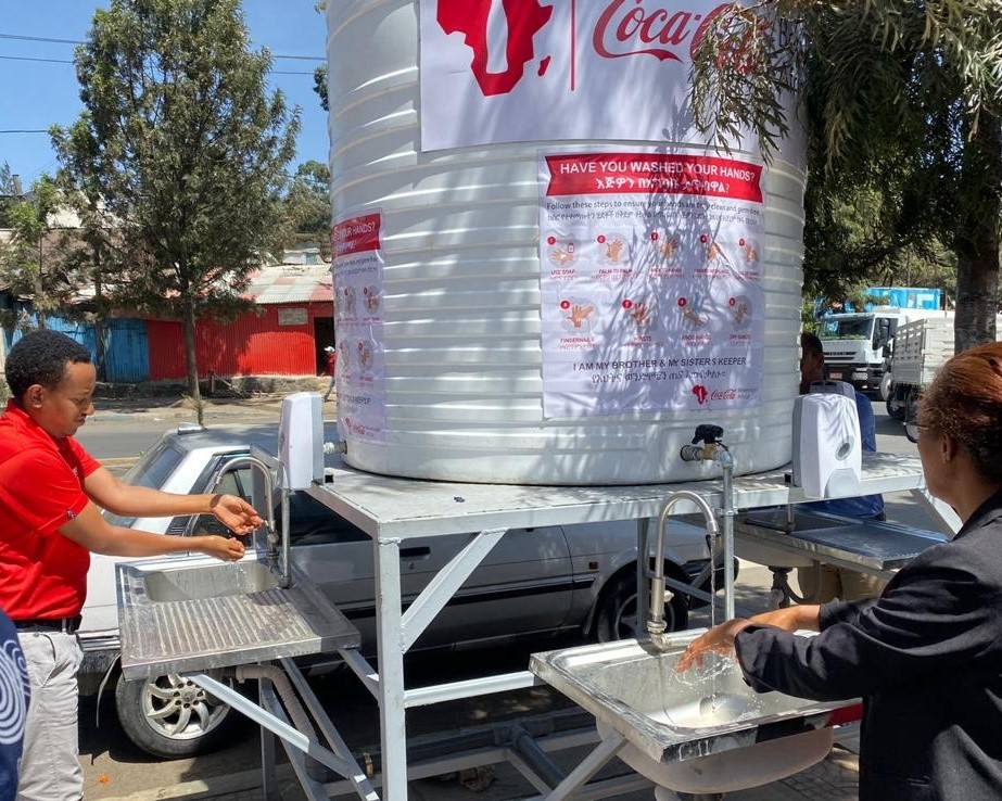 Clean water is used to wash hands at a Coca-Cola hand-washing station