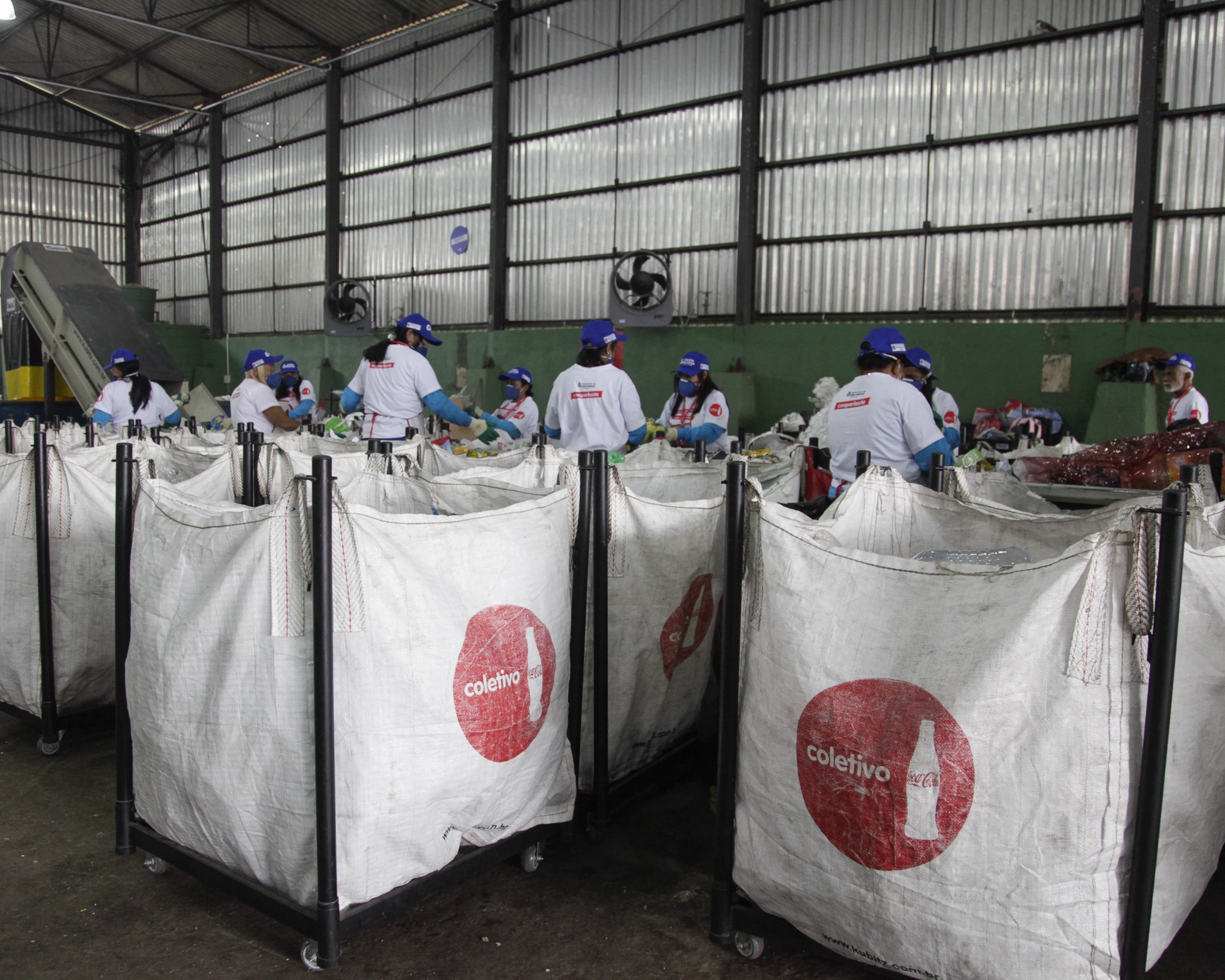 Recycling collectors in Brazil sort and bag materials